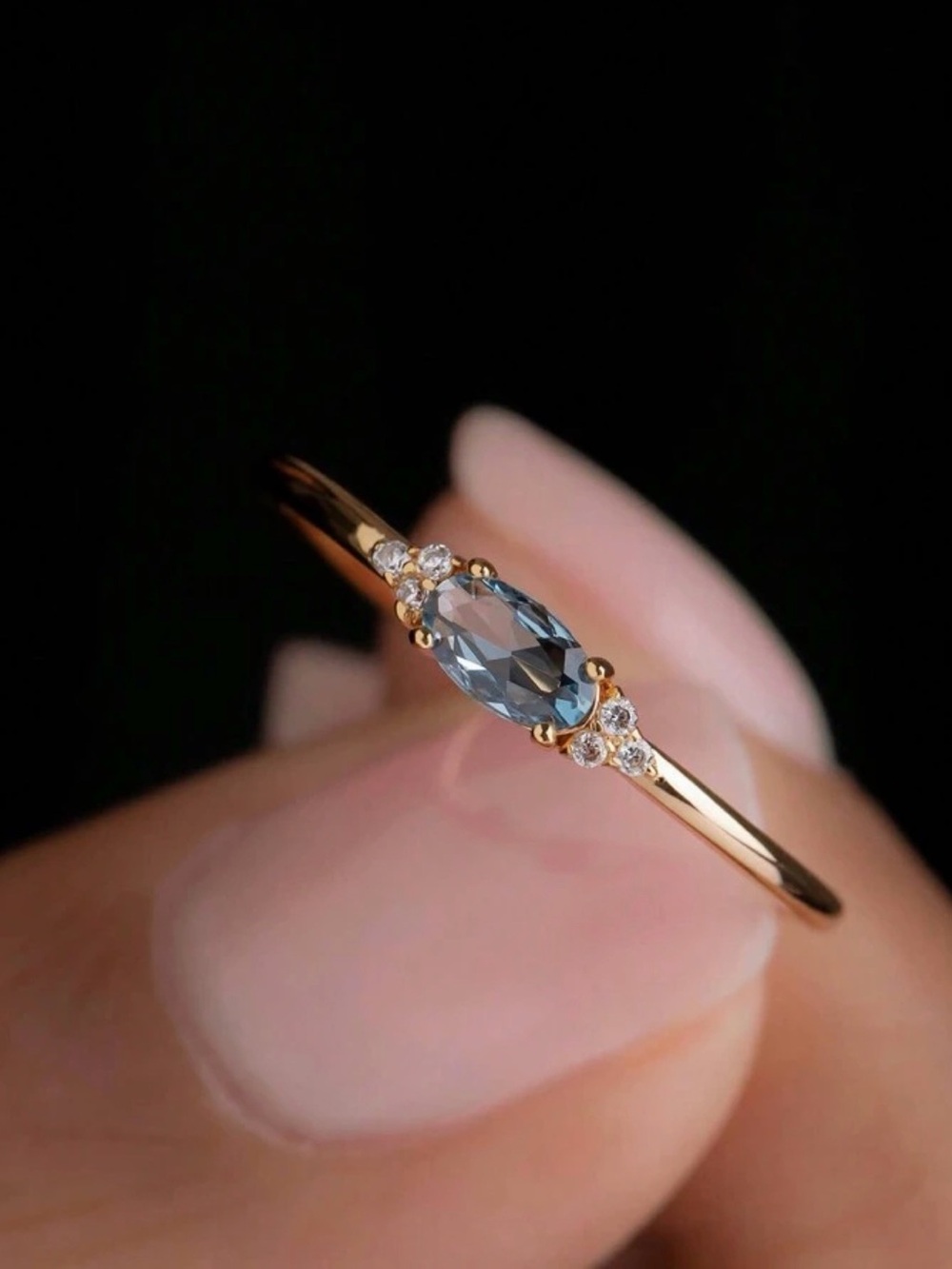 Elegant Gold Band Ring with Blue Marquise Stone
